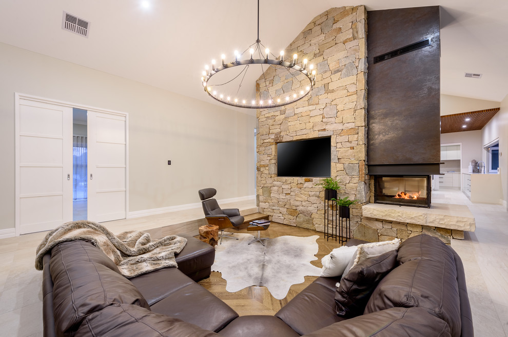 Inspiration for a large contemporary formal open concept living room in Perth with medium hardwood floors, a two-sided fireplace, a stone fireplace surround, a wall-mounted tv, beige floor and beige walls.