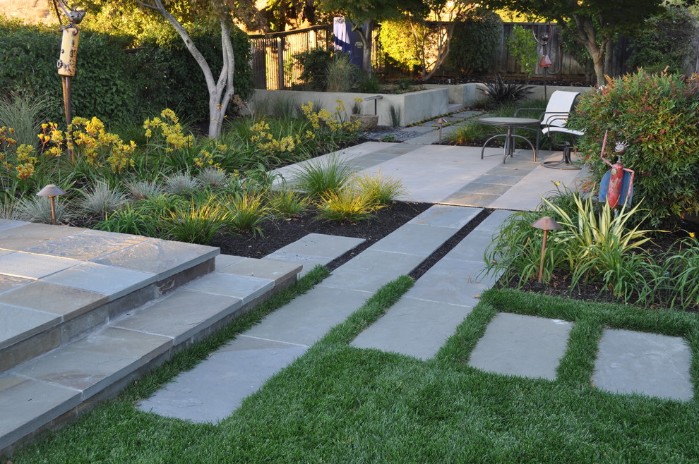 Photo of an asian backyard garden in San Francisco with natural stone pavers.
