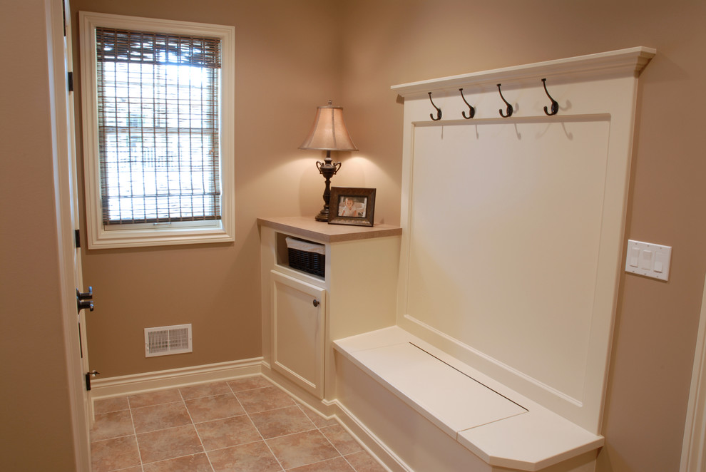 Photo of a traditional mudroom in Grand Rapids with ceramic floors.