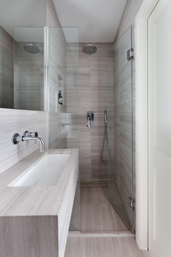 Photo of a small contemporary master bathroom in London with flat-panel cabinets, grey cabinets, an open shower, gray tile, porcelain tile, grey walls, ceramic floors, a wall-mount sink, engineered quartz benchtops, grey floor, a hinged shower door, grey benchtops, a single vanity, a built-in vanity and brick walls.