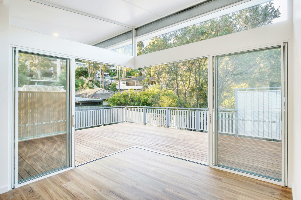 Inspiration for a mid-sized beach style detached granny flat in Sydney.
