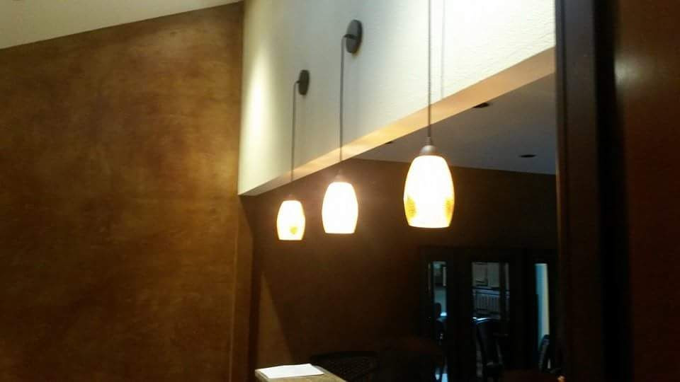 Eat-in kitchen - large rustic l-shaped marble floor, multicolored floor and vaulted ceiling eat-in kitchen idea in Austin with an undermount sink, shaker cabinets, dark wood cabinets, granite countertops, multicolored backsplash, metal backsplash, stainless steel appliances, an island and multicolored countertops