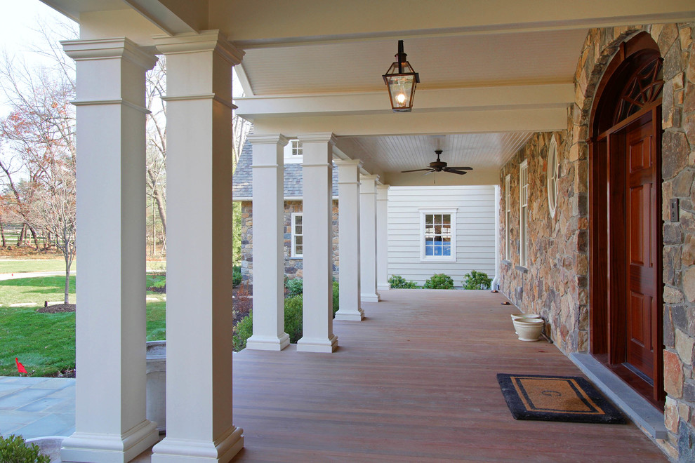 Photo of a traditional front yard verandah in Philadelphia with decking and a roof extension.