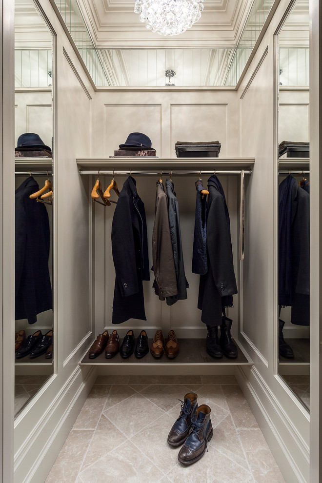 This is an example of a traditional men's storage and wardrobe in Toronto with travertine floors.