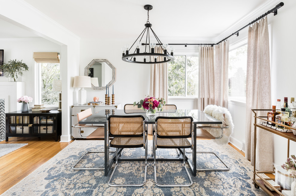 Inspiration for a transitional open plan dining in Seattle with white walls, medium hardwood floors and brown floor.