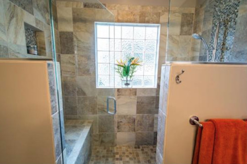 Photo of a mid-sized contemporary master bathroom in Raleigh with raised-panel cabinets, grey cabinets, an alcove shower, a two-piece toilet, stone tile, beige walls, travertine floors, an undermount sink and granite benchtops.