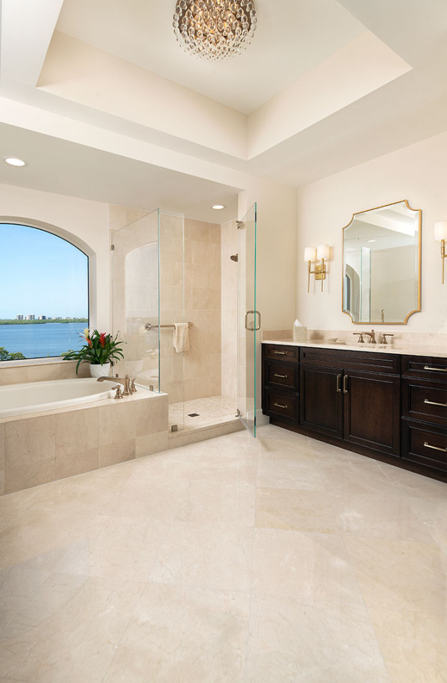 This is an example of a large contemporary ensuite bathroom in Miami with recessed-panel cabinets, brown cabinets, a built-in bath, an alcove shower, a two-piece toilet, beige tiles, marble tiles, beige walls, marble flooring, a submerged sink, marble worktops, beige floors, a hinged door, beige worktops, a single sink, a built in vanity unit and a drop ceiling.