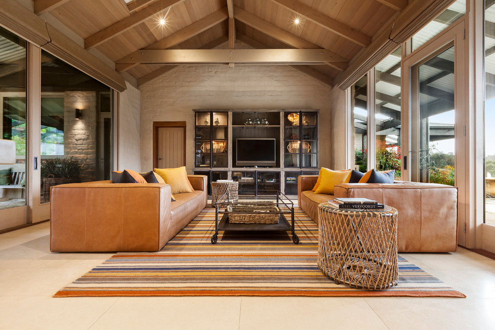 Inspiration for a country family room in Melbourne with a built-in media wall.