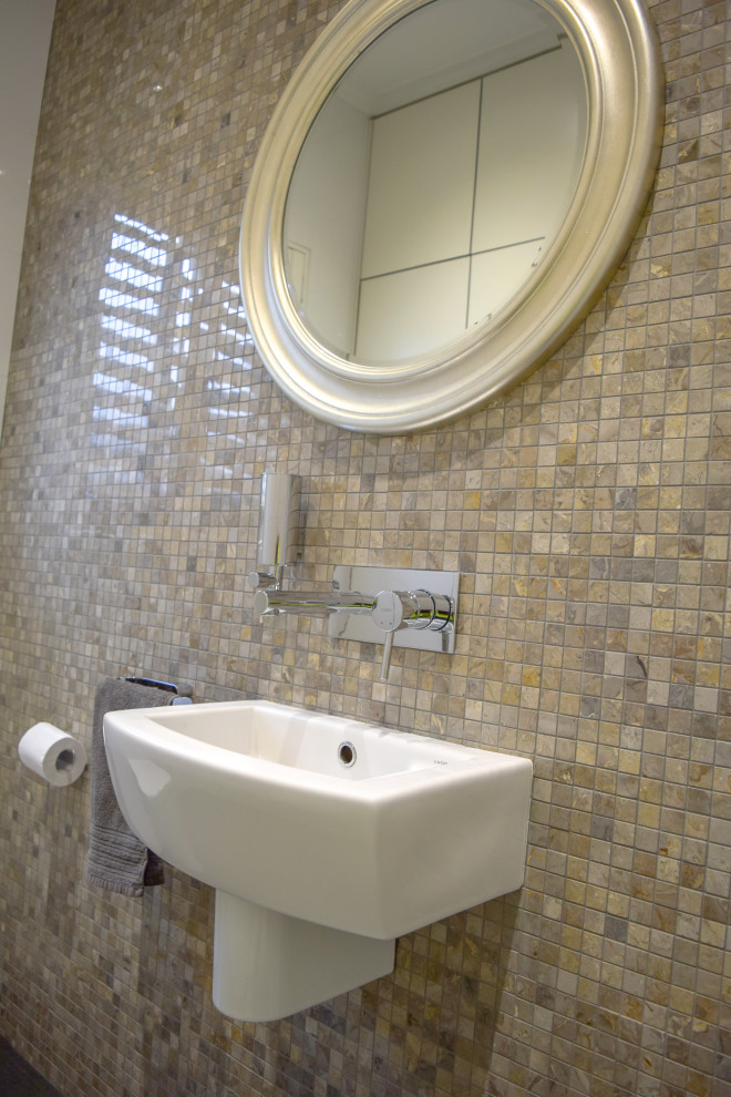 Design ideas for a small contemporary powder room in Sydney with gray tile, marble and a wall-mount sink.