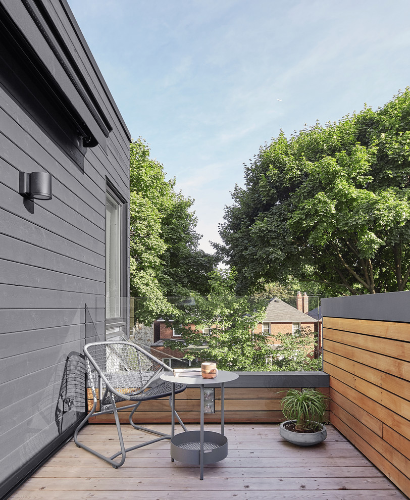 Design ideas for a scandinavian deck in Toronto with a container garden and no cover.
