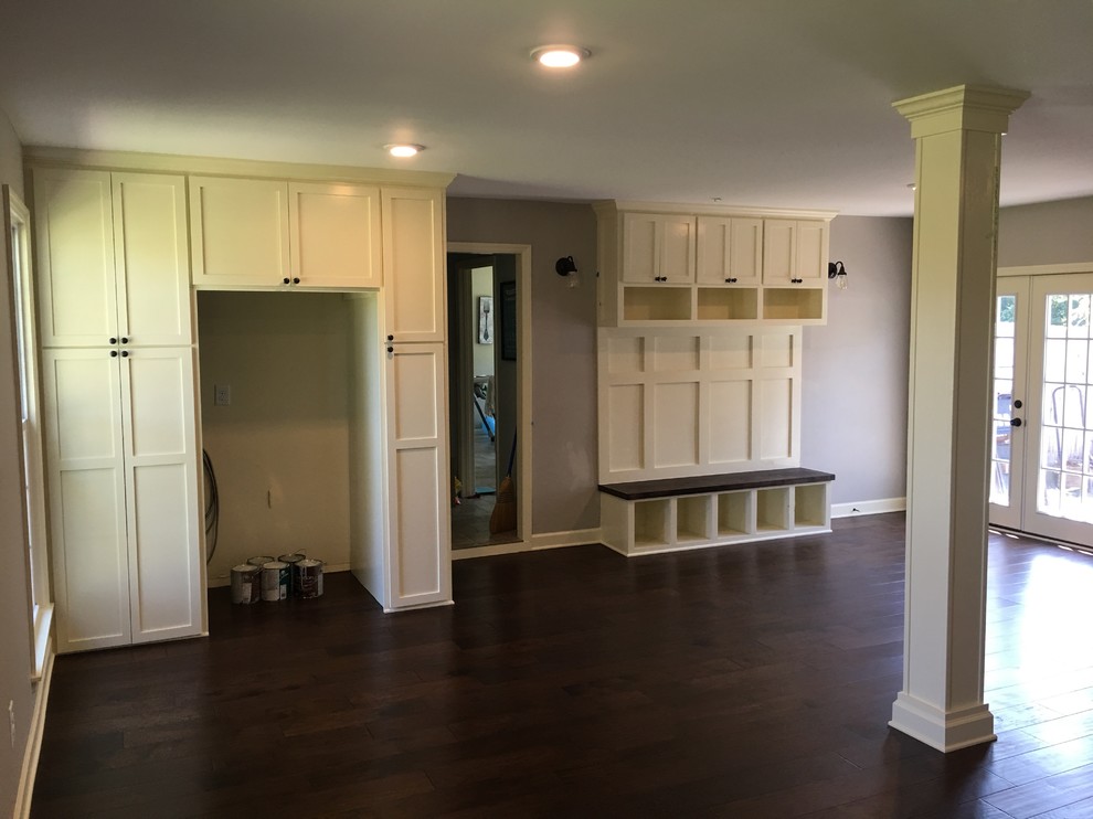Garage conversion family room with mud locker and built ins