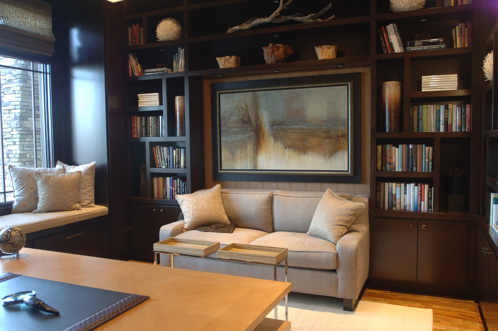 Photo of a large transitional study room in Orlando with brown walls, medium hardwood floors, no fireplace and a freestanding desk.