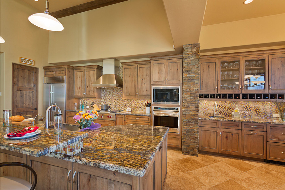 Inspiration for an expansive country open plan kitchen in Phoenix with an undermount sink, flat-panel cabinets, medium wood cabinets, granite benchtops, stainless steel appliances and with island.