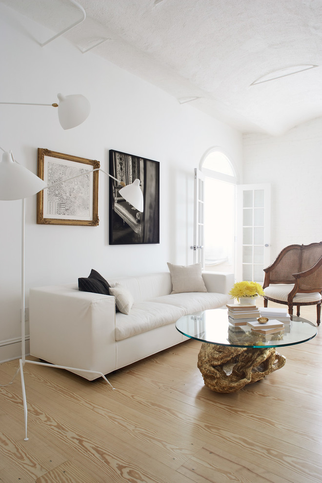 Inspiration for a contemporary living room in New York with white walls.