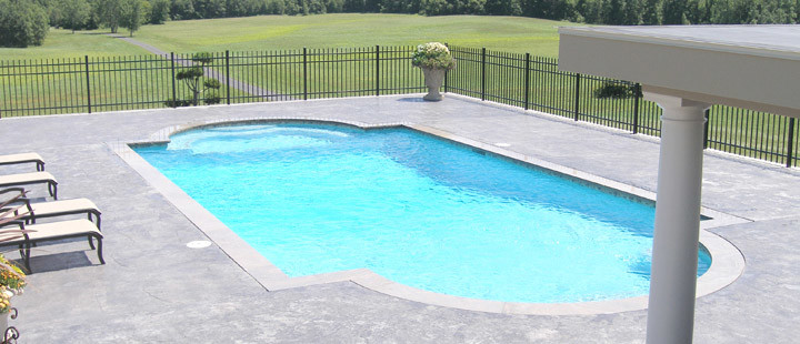 Design ideas for a large modern backyard custom-shaped pool in New York with a hot tub and stamped concrete.