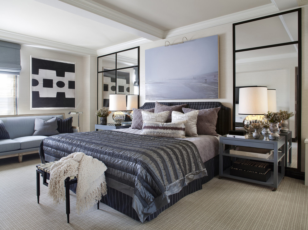 This is an example of a transitional bedroom in New York with beige walls, carpet and beige floor.