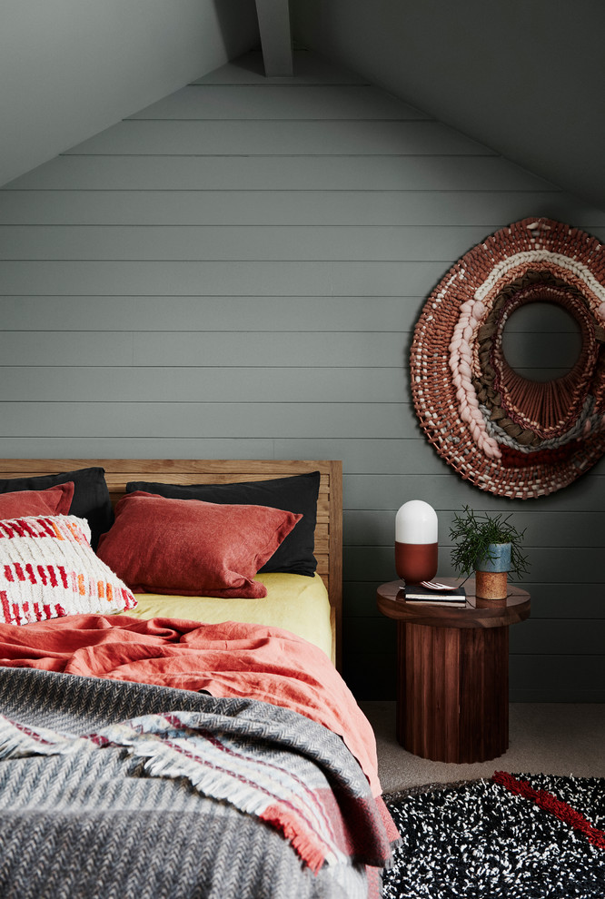 Contemporary bedroom in Wellington with grey walls, carpet and brown floor.