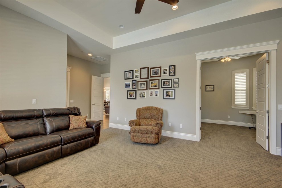 Large transitional look-out medium tone wood floor and beige floor basement photo in Phoenix with gray walls