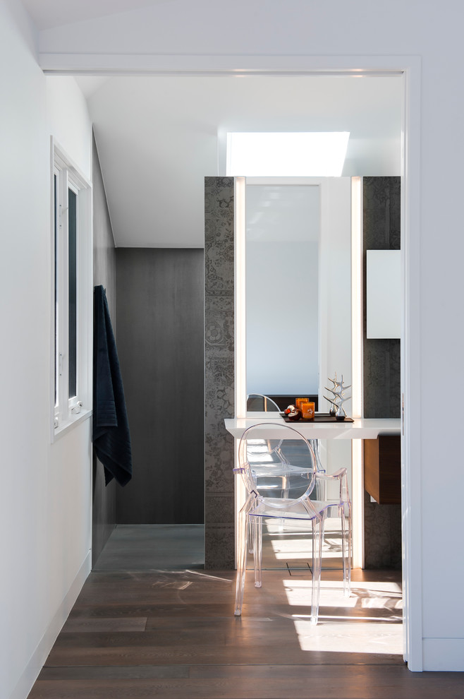 Photo of a small modern master bathroom in Sydney with an integrated sink, furniture-like cabinets, medium wood cabinets, solid surface benchtops, an open shower, a one-piece toilet, gray tile, porcelain tile, grey walls and porcelain floors.