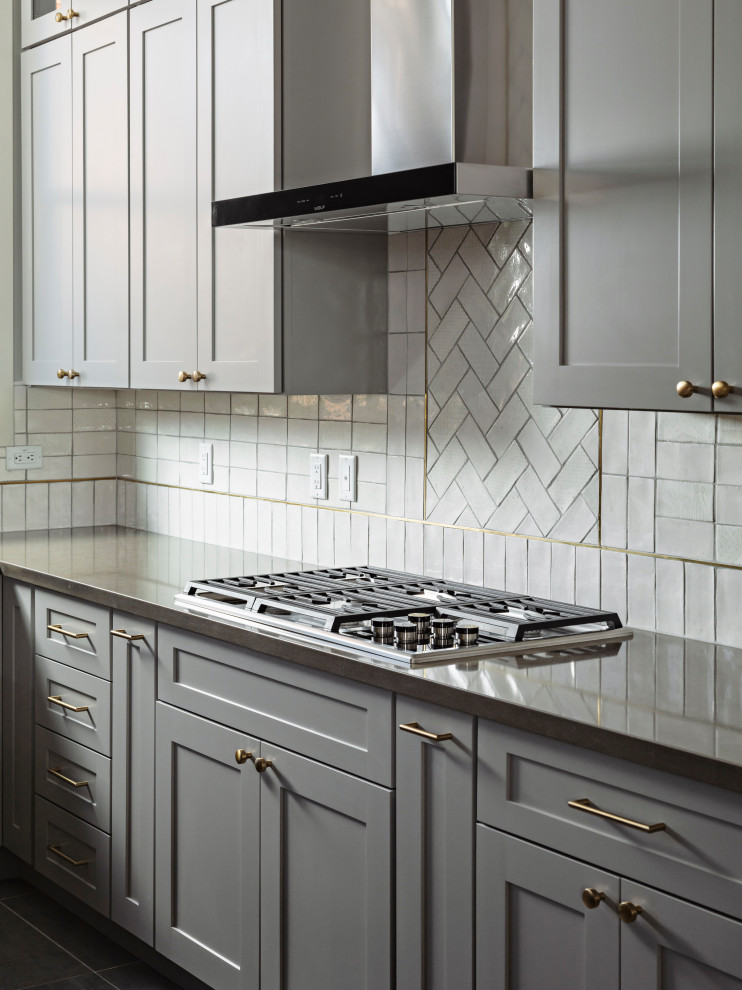 Eat-in kitchen - large transitional galley ceramic tile and gray floor eat-in kitchen idea in Phoenix with an undermount sink, shaker cabinets, gray cabinets, quartz countertops, white backsplash, ceramic backsplash, stainless steel appliances, an island and gray countertops