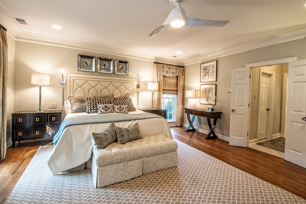 Large traditional master bedroom in Other with grey walls, medium hardwood floors and no fireplace.