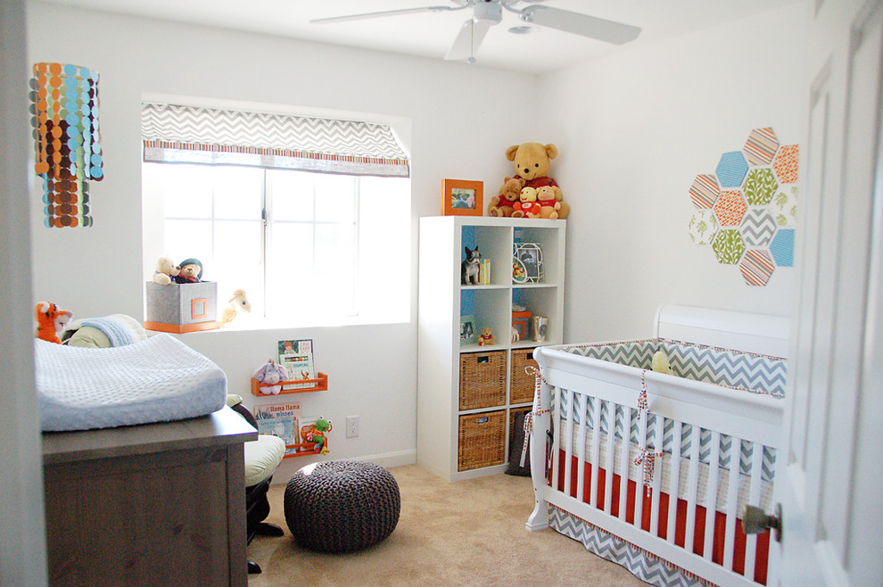 Transitional gender-neutral nursery in San Francisco with white walls and carpet.