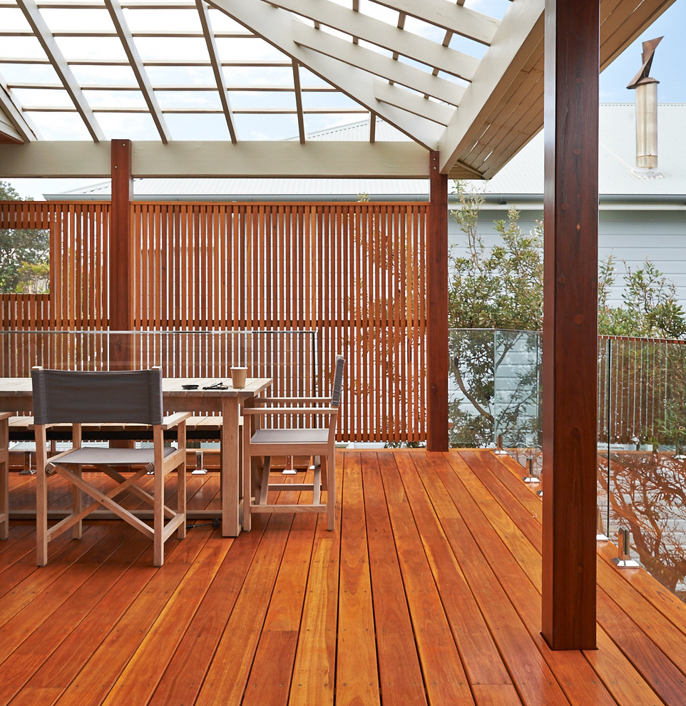 Inspiration for a large beach style balcony in Sydney with a roof extension.