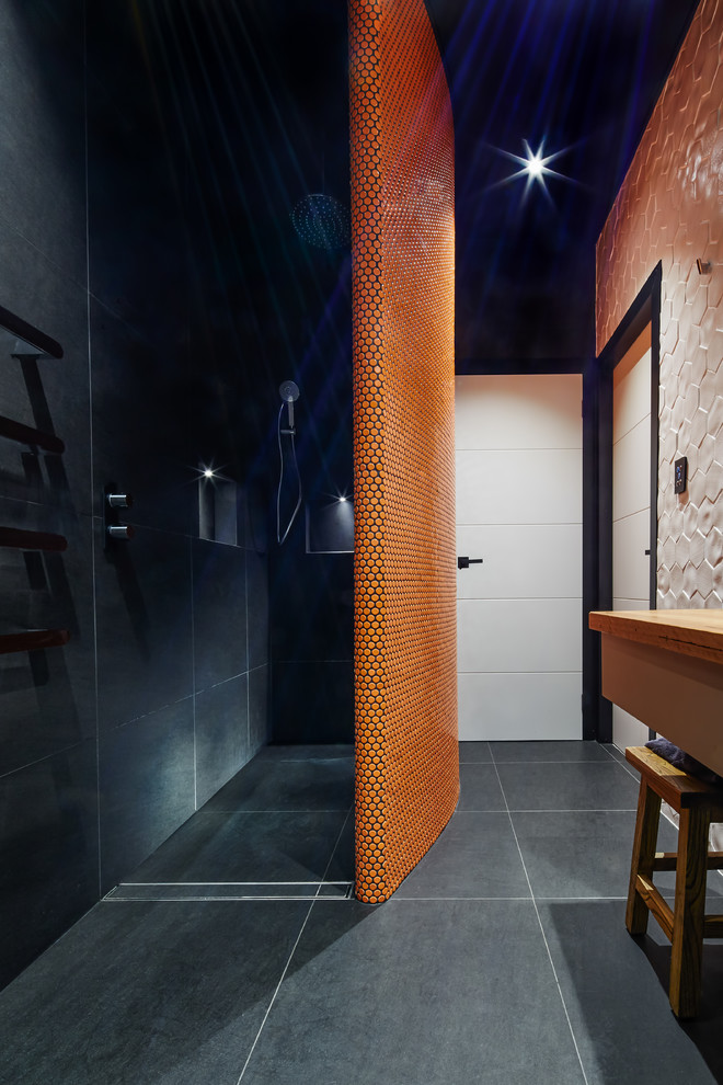 Inspiration for a small modern bathroom in Sydney with furniture-like cabinets, an open shower, orange tile, porcelain floors and wood benchtops.