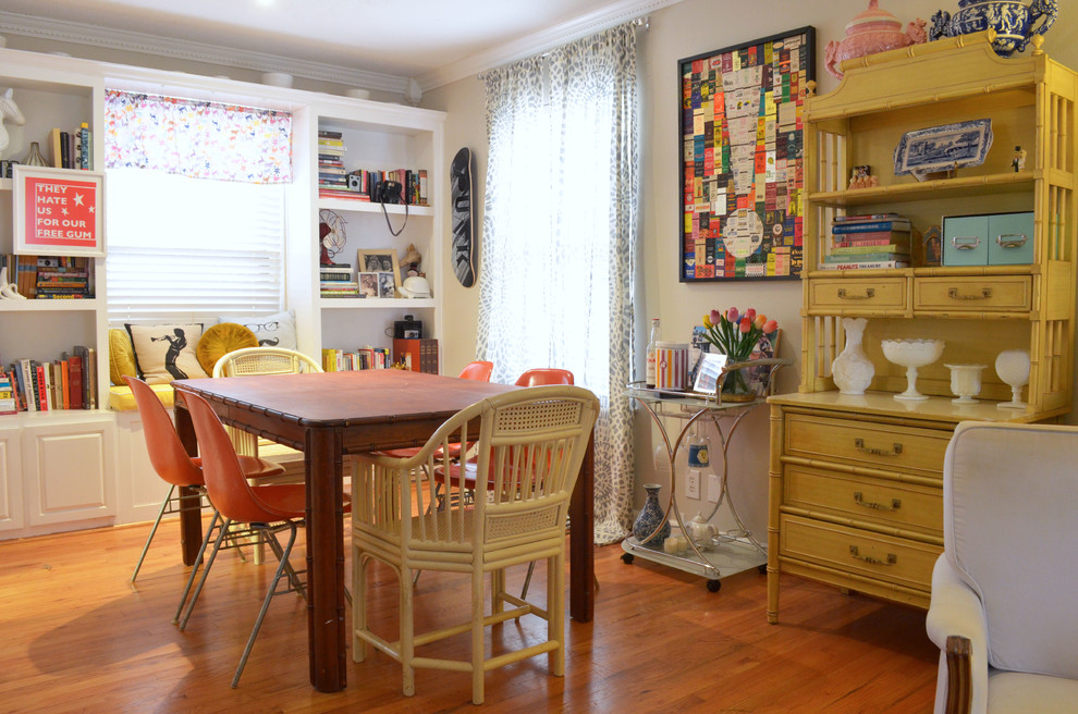 Inspiration for an eclectic dining room in Dallas with beige walls and medium hardwood floors.