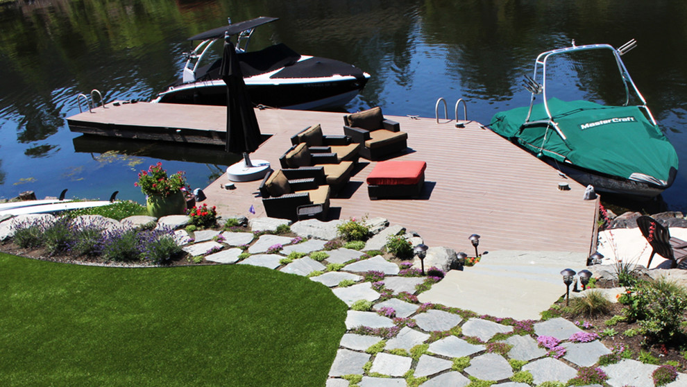 Photo of a large transitional partial sun backyard stone formal garden in Seattle for summer.