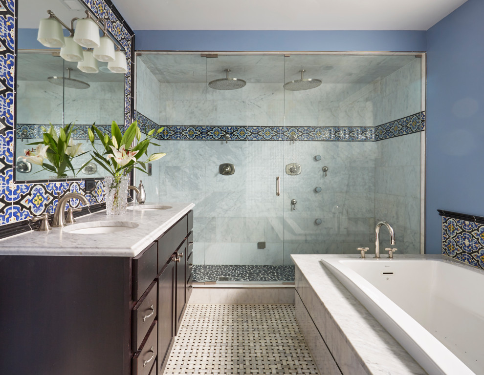 Photo of a transitional bathroom in Chicago with shaker cabinets, dark wood cabinets, a drop-in tub, a double shower, multi-coloured tile, blue walls, mosaic tile floors, an undermount sink, multi-coloured floor, a hinged shower door and grey benchtops.