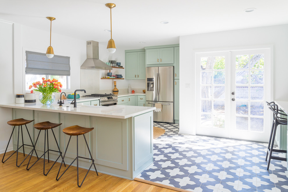 Inspiration for a transitional eat-in kitchen in Los Angeles with shaker cabinets, green cabinets, quartz benchtops and stainless steel appliances.