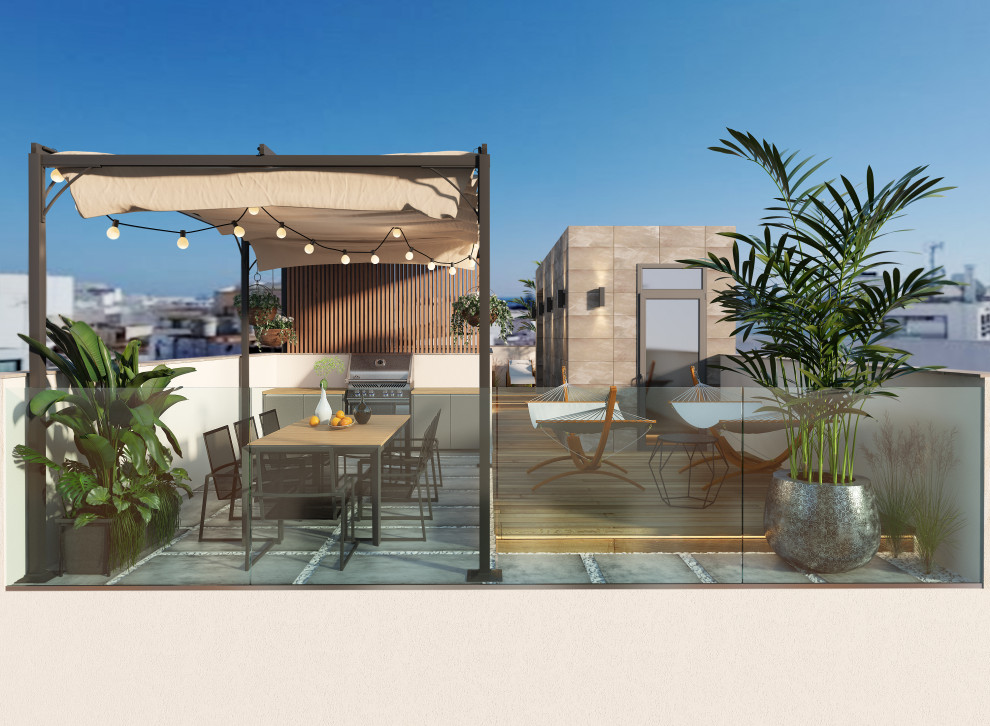 Idées déco pour une terrasse sur le toit moderne avec une cuisine d'été, une pergola et un garde-corps en verre.