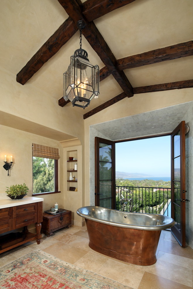 Design ideas for a mediterranean bathroom in Los Angeles with a freestanding tub.