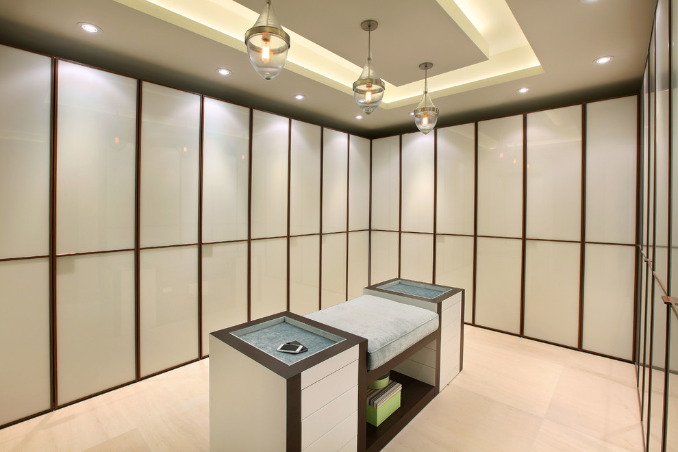 Photo of a contemporary gender-neutral walk-in wardrobe in Miami with flat-panel cabinets and white cabinets.
