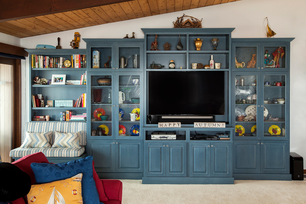 Inspiration for a large beach style family room in Boston with white walls, carpet and a built-in media wall.