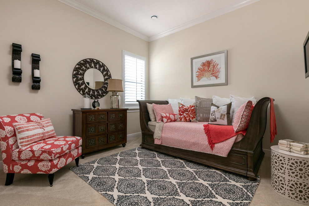 This is an example of a mid-sized mediterranean guest bedroom in Orlando with beige walls, carpet and no fireplace.