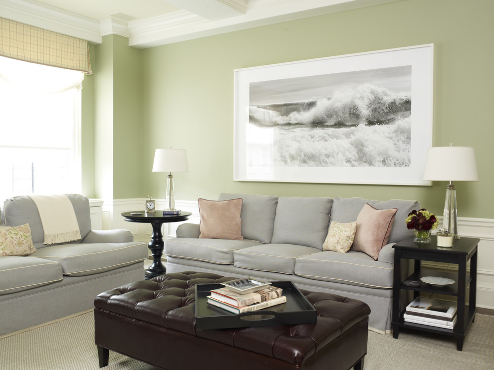 This is an example of a traditional family room in New York with green walls.
