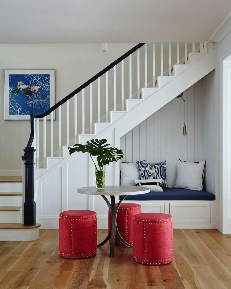 Example of a mid-sized beach style wooden l-shaped staircase design in San Diego with painted risers