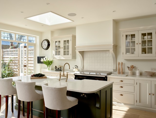 Beige Cabinets + Brass Hardware Bringing Charm To A Traditional Kitchen