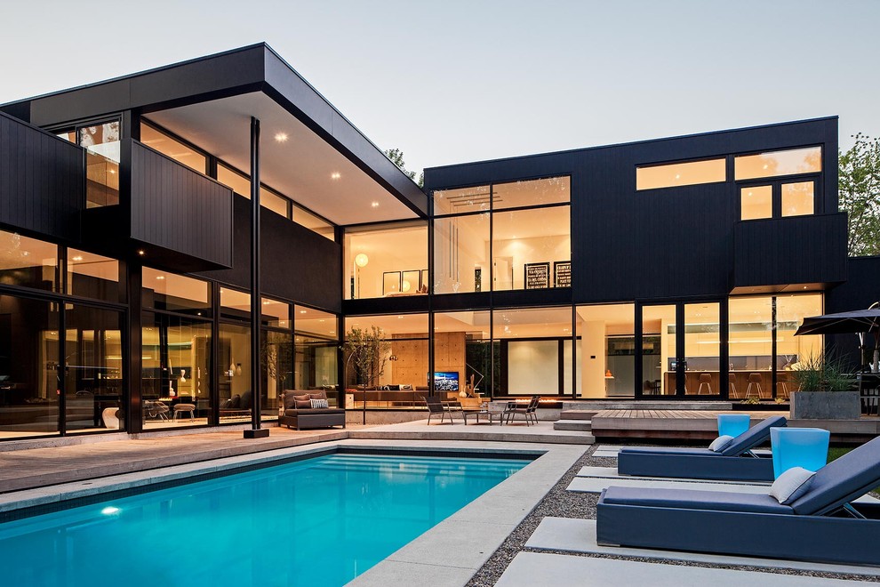 Inspiration for a modern two-storey black exterior in Toronto.