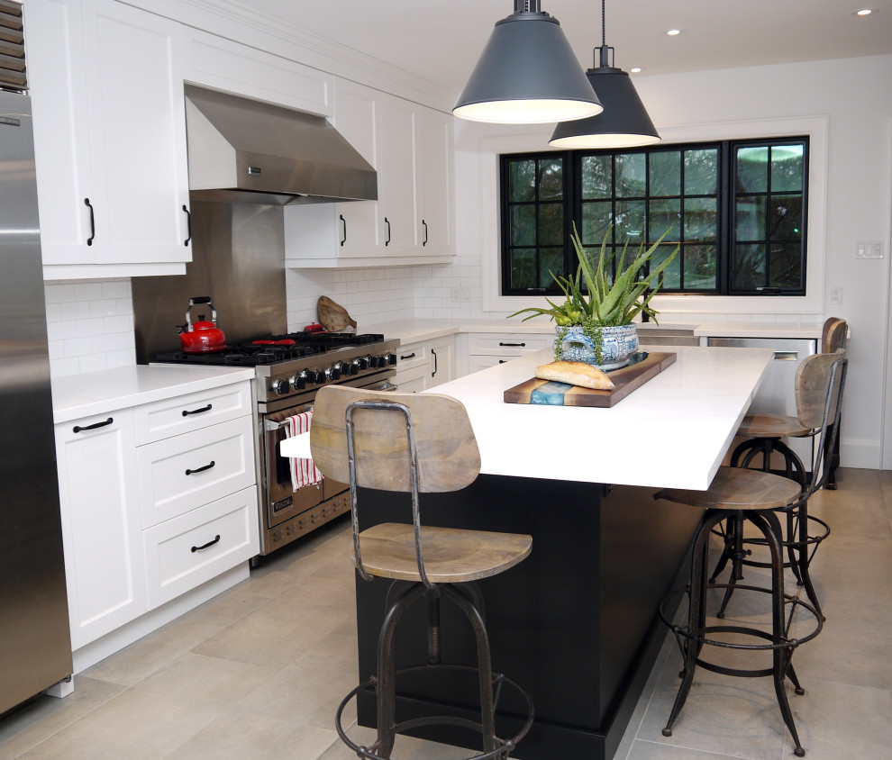 Inspiration for a mid-sized transitional l-shaped porcelain tile and gray floor enclosed kitchen remodel in Toronto with a farmhouse sink, recessed-panel cabinets, white cabinets, quartz countertops, white backsplash, porcelain backsplash, stainless steel appliances, an island and white countertops