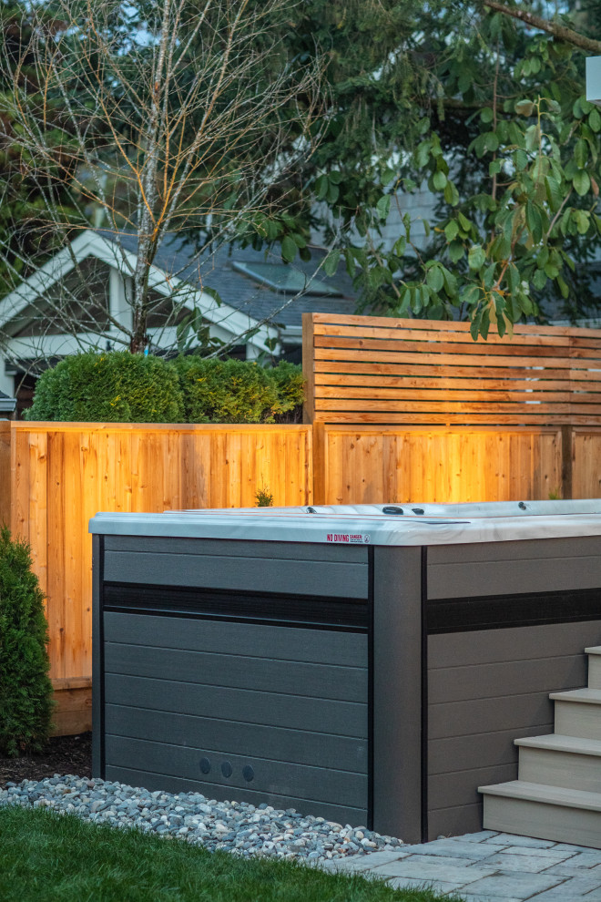 Example of a transitional home design design in Vancouver