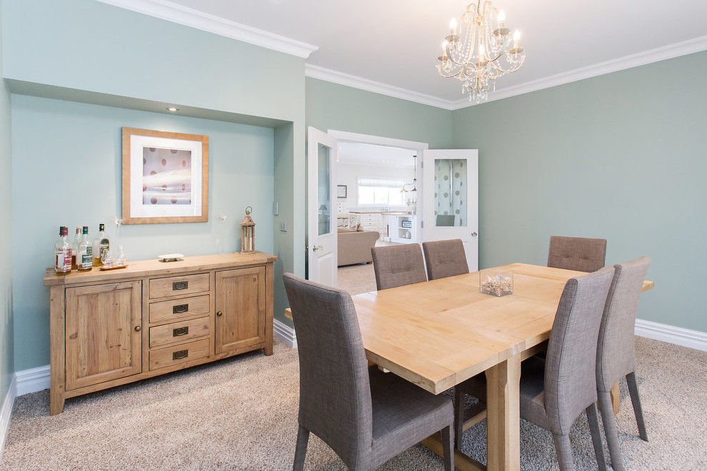 Design ideas for a Mid-sized country separate dining room in Christchurch With Green Walls, Carpet and Grey Floor.