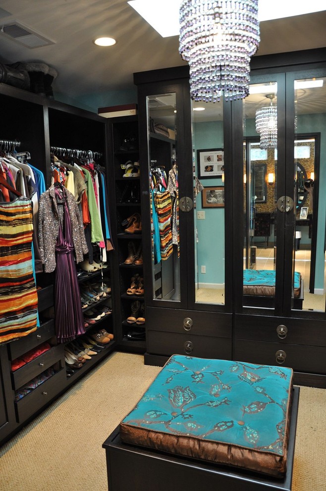 Small contemporary women's walk-in wardrobe in San Francisco with flat-panel cabinets, dark wood cabinets and carpet.