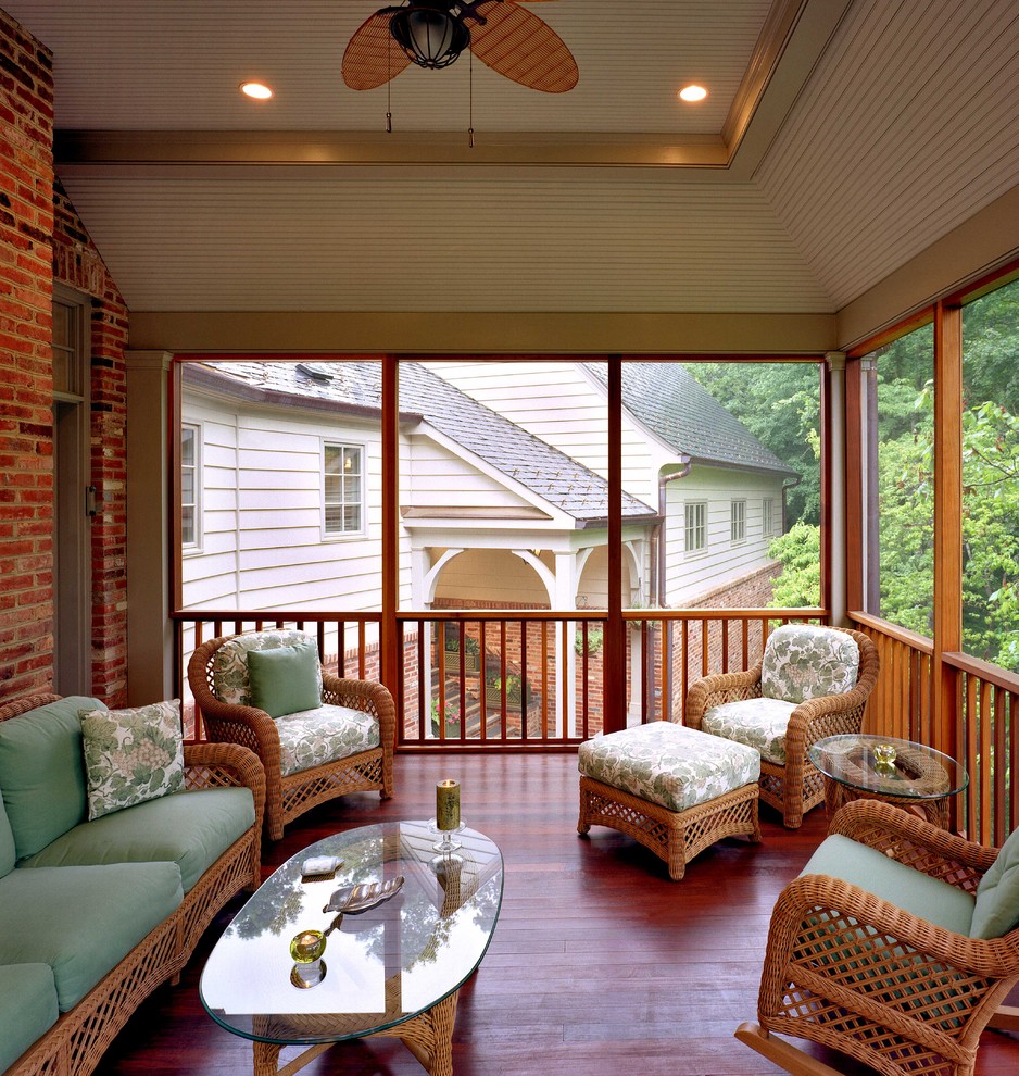 This is an example of a traditional backyard screened-in verandah in DC Metro with decking and a roof extension.