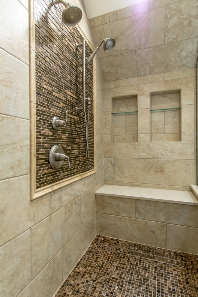 Example of a huge minimalist master beige tile and stone tile double-sink and vaulted ceiling bathroom design in Chicago with dark wood cabinets, marble countertops, a hinged shower door and a built-in vanity