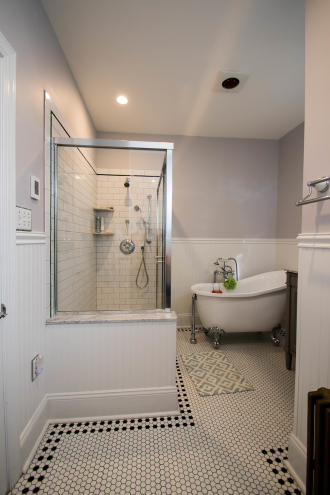 This is an example of a mid-sized traditional master bathroom in Philadelphia with recessed-panel cabinets, grey cabinets, a claw-foot tub, a double shower, a two-piece toilet, white tile, ceramic tile, grey walls, ceramic floors, an undermount sink and marble benchtops.