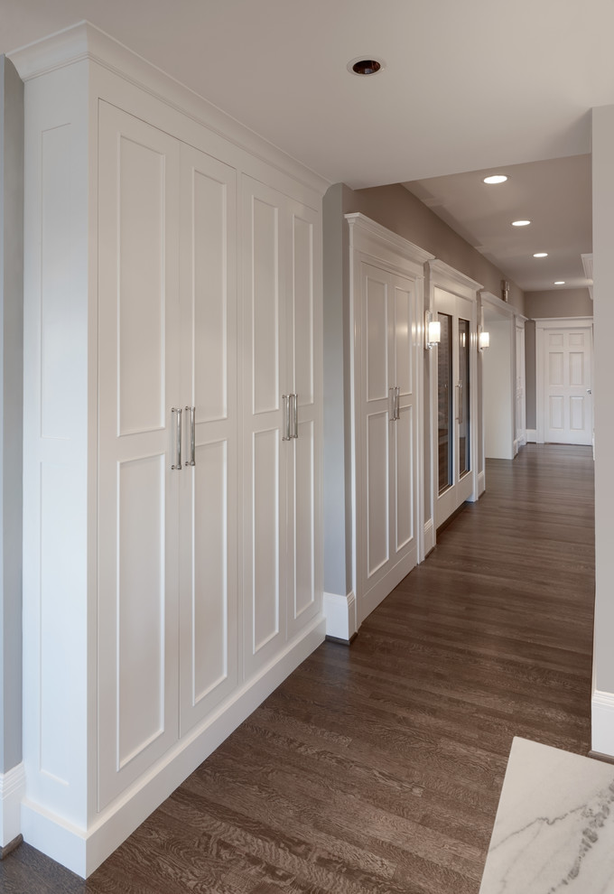 Mid-sized traditional hallway in Portland with grey walls, medium hardwood floors and brown floor.