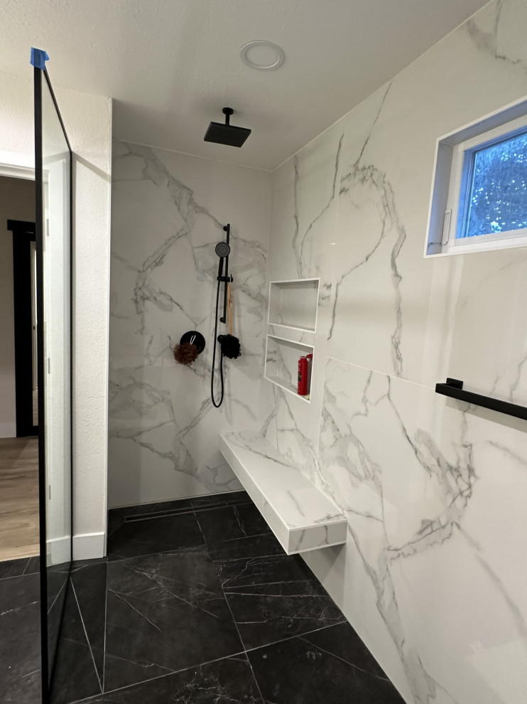 Large contemporary master bathroom in Los Angeles with flat-panel cabinets, brown cabinets, a freestanding tub, a curbless shower, a one-piece toilet, white tile, marble, white walls, marble floors, an undermount sink, quartzite benchtops, black floor, an open shower, white benchtops, a shower seat, a double vanity and a floating vanity.